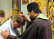Fr Ivan assists in an Altar Call