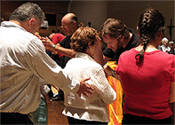 David Harp prays for healing at Five Nights of Fire, Miami. FL