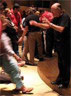 Eddie prays for healing at 5NF - She falls under the power of the Holy Spirit.